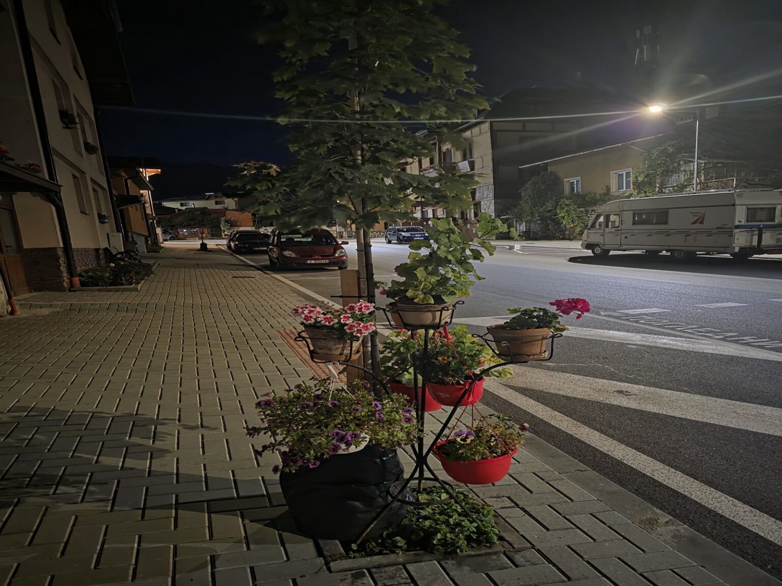 Flowers and traditional details on a street in Bansko