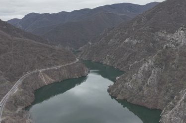 Aerial view of the Vacha reservoir between rocky mountain slopes near Krichim