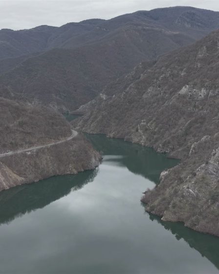 Aerial view of the Vacha reservoir between rocky mountain slopes near Krichim