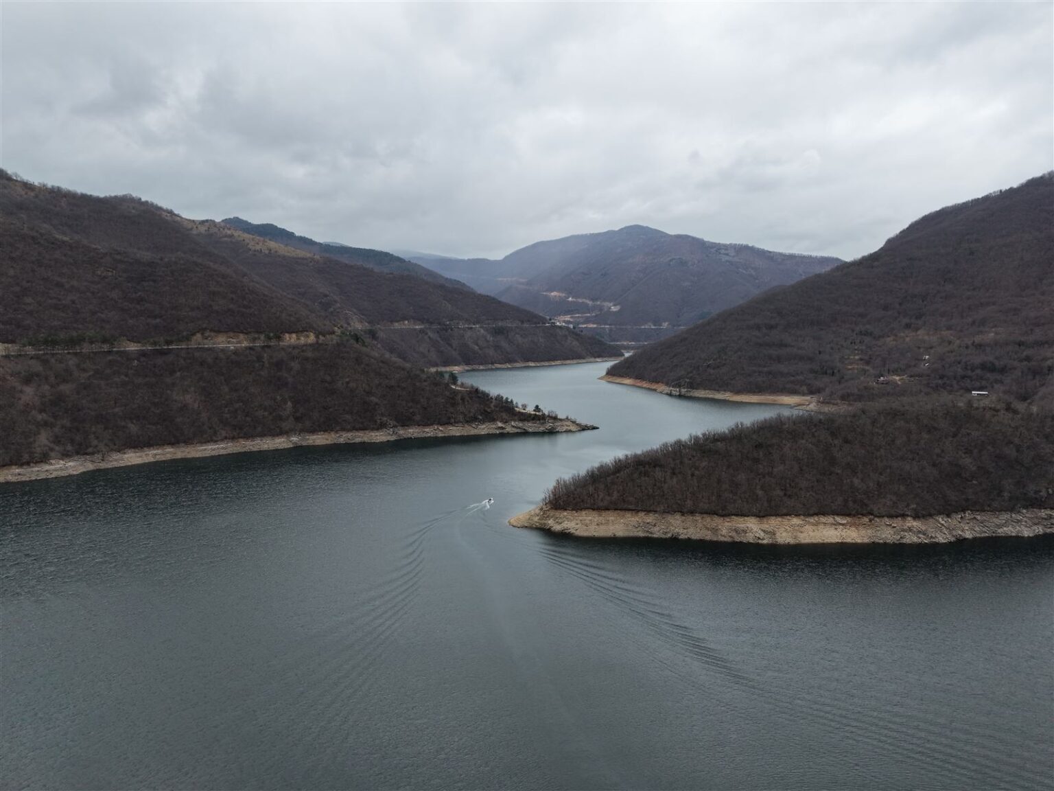 Aerial view of Vacha Reservoir with a boat
