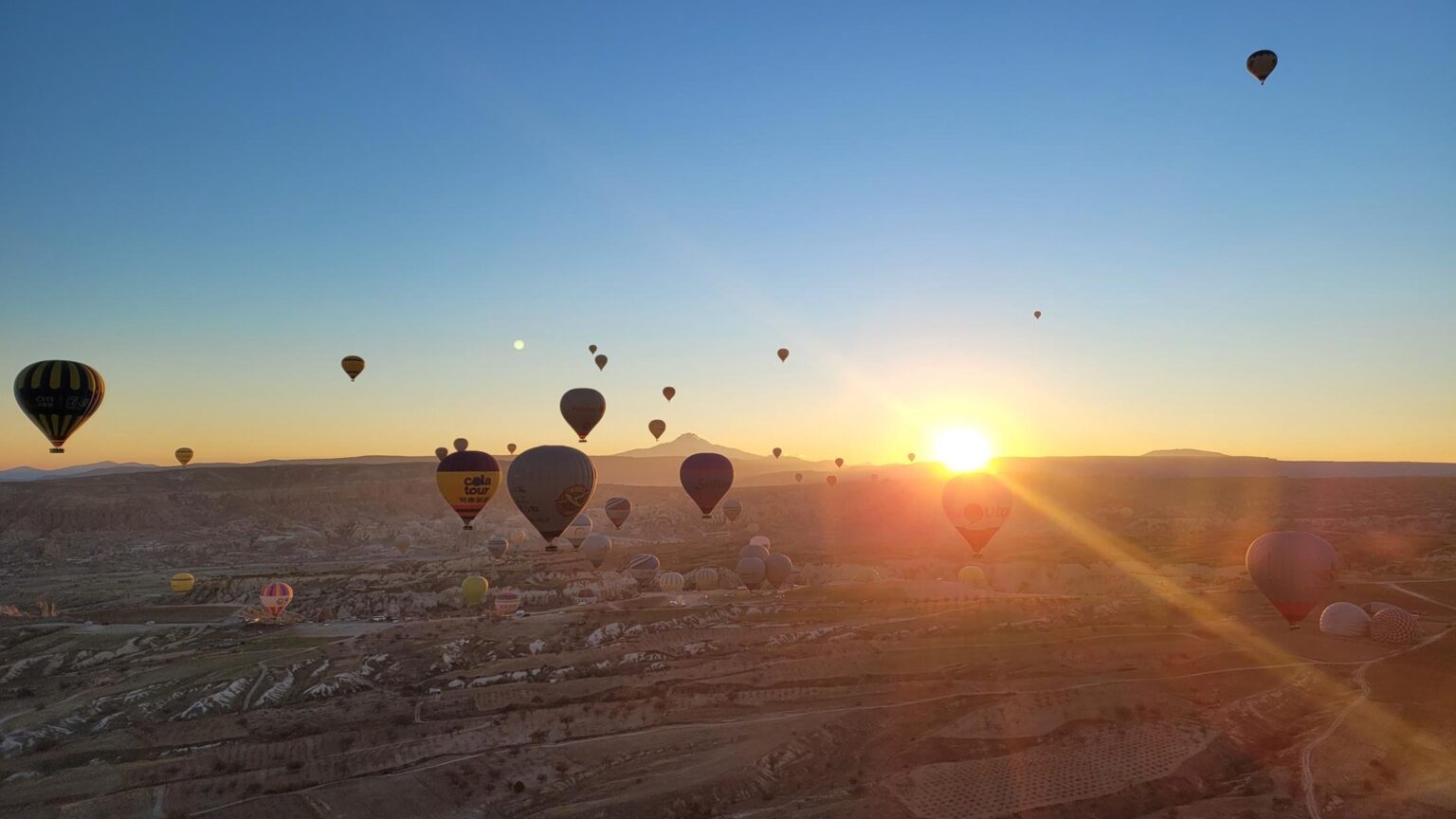 Balloons over Cappadocia at sunrise — 21