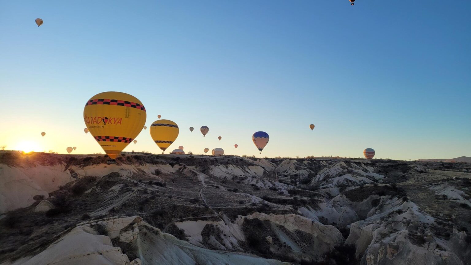 Balloons over Cappadocia at sunrise — 24