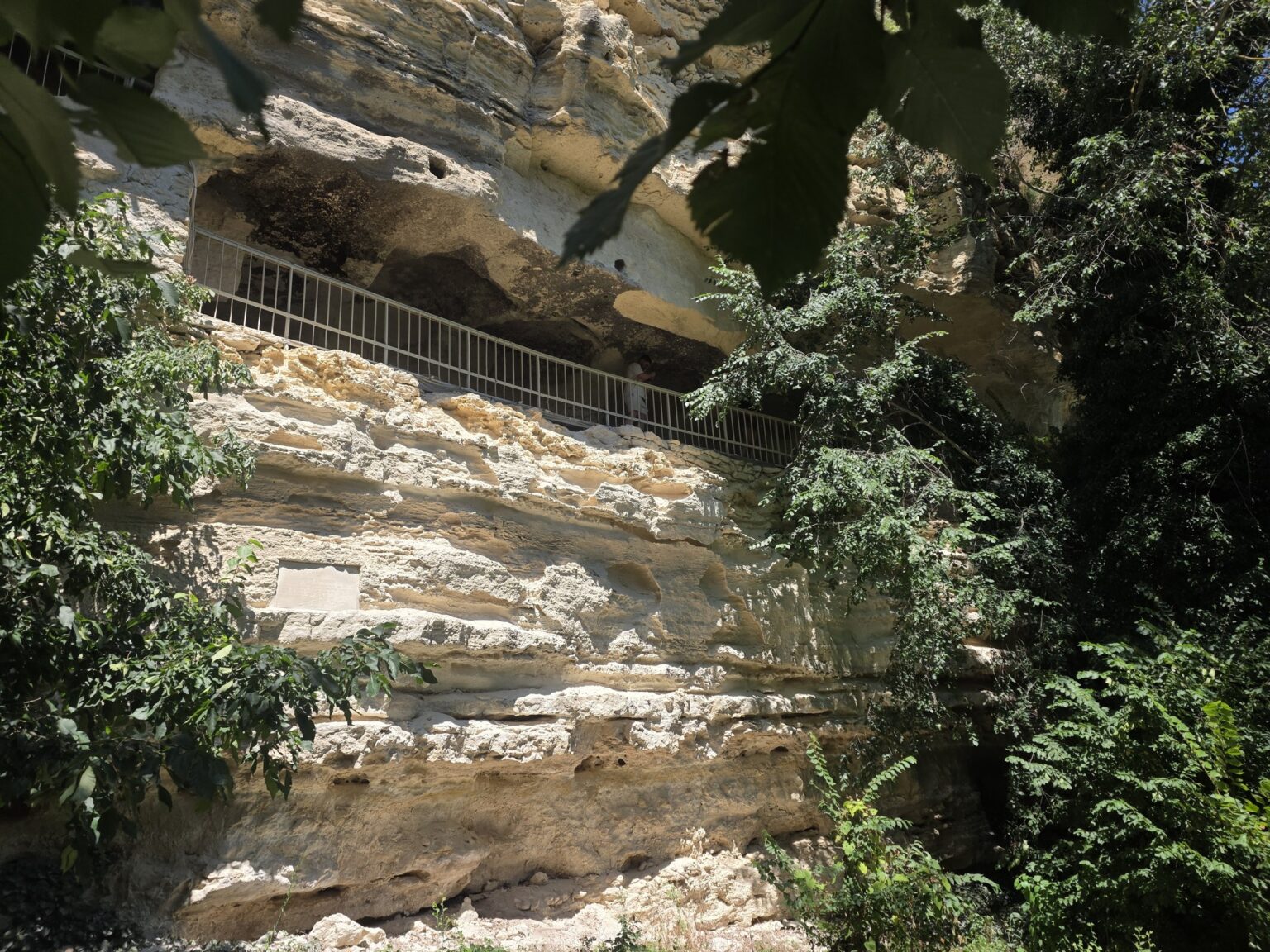Rock facade and metal railings in Aladzha Monastery