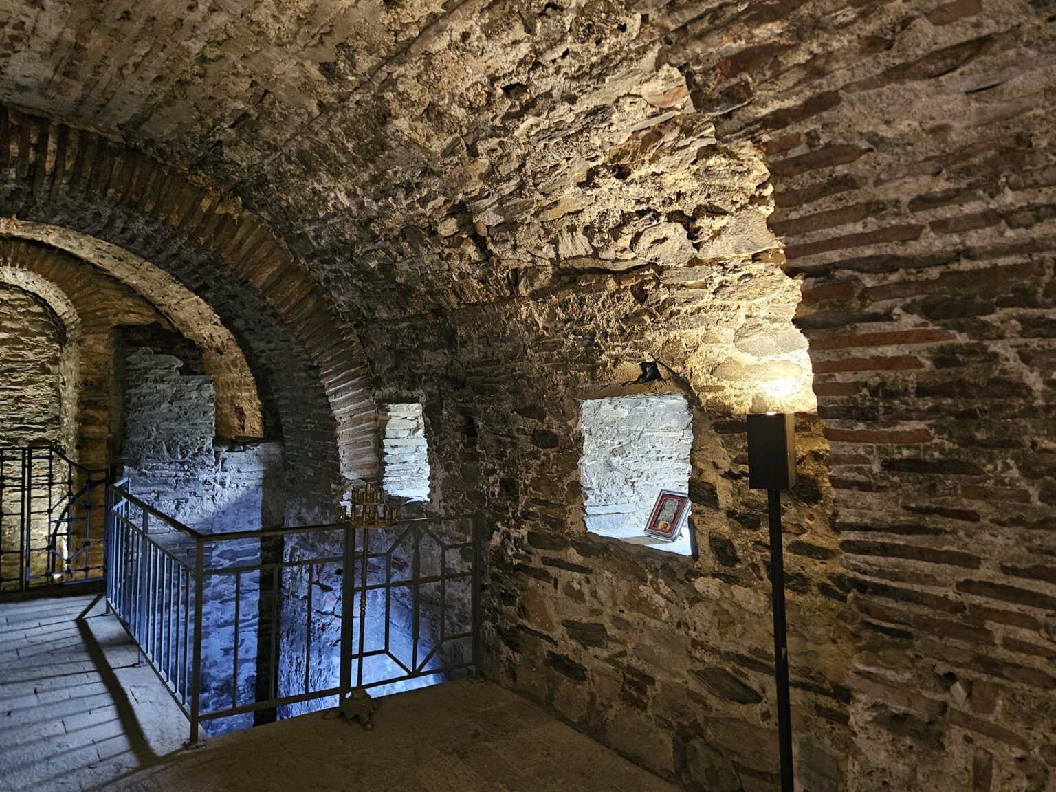 Lit stone corridor with windows in Asen's Fortress