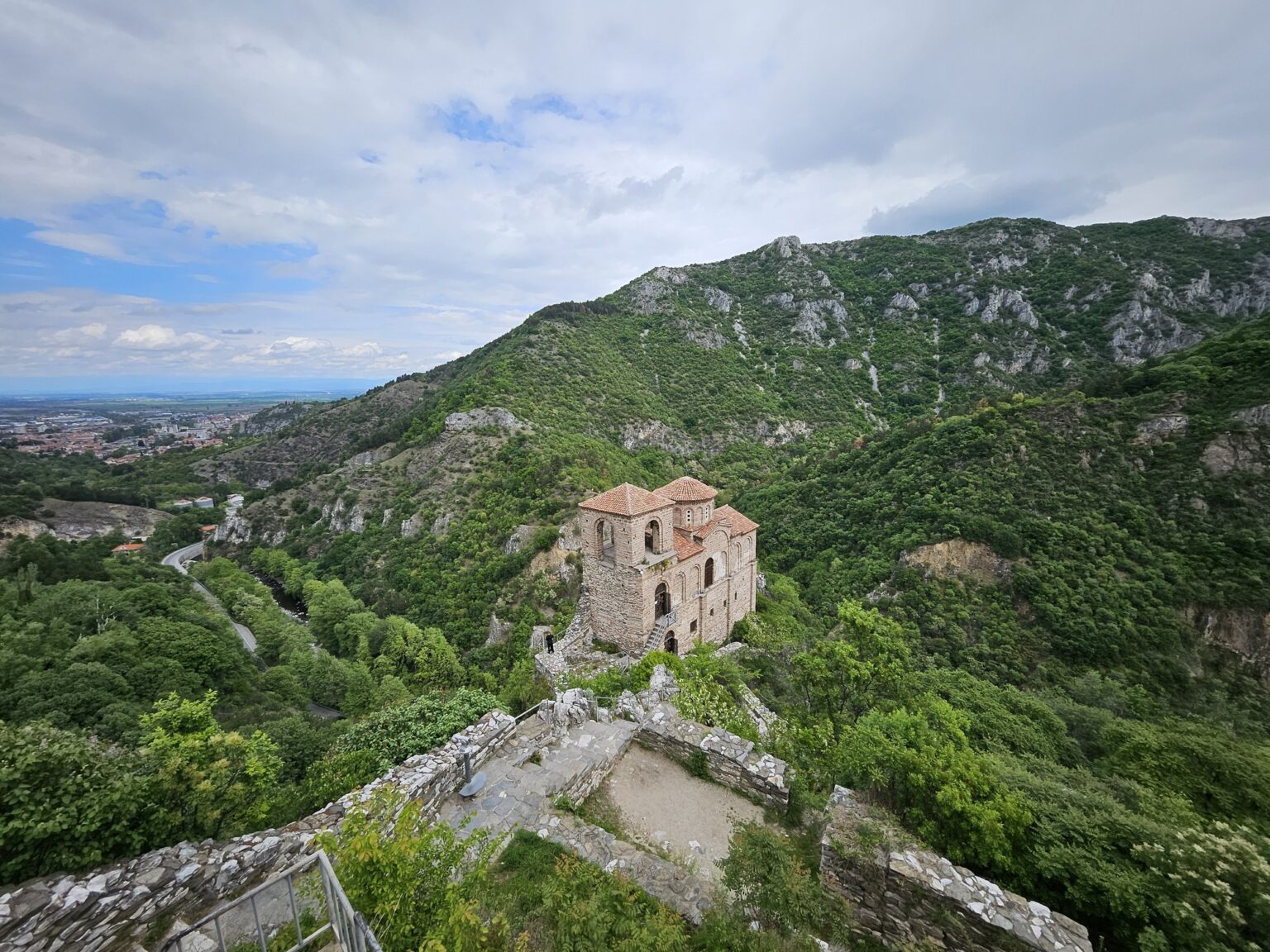 Medieval church against the green mountains near Asen's Fortress