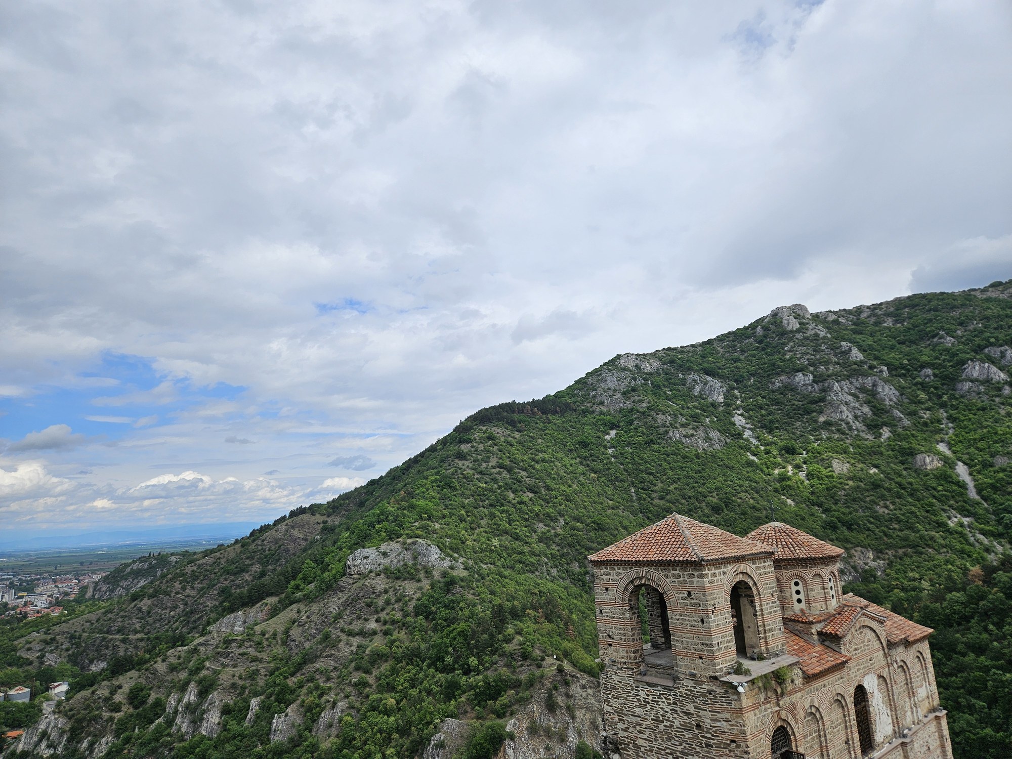 The stone church of Asenova krepost among the green mountains