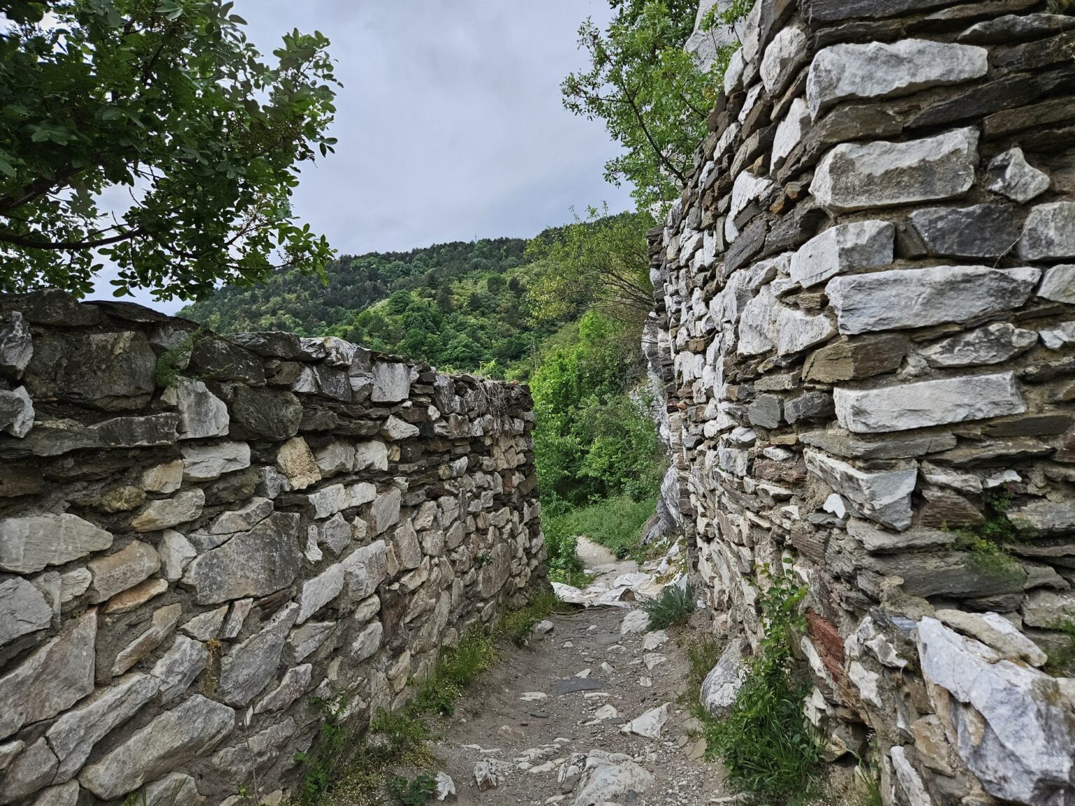 Stone path between sturdy fortress walls