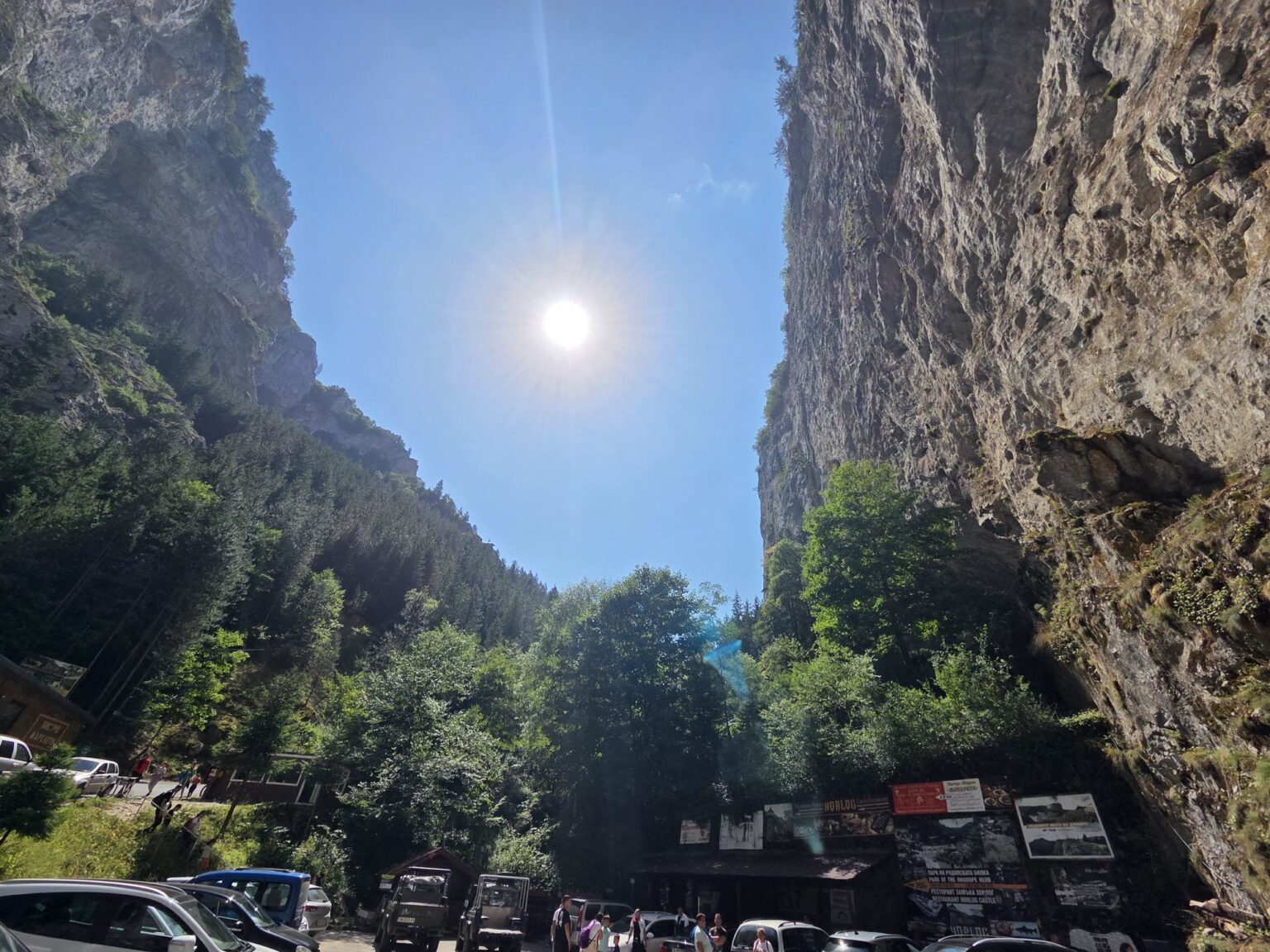 View of rocks and parked cars in front of the entrance
