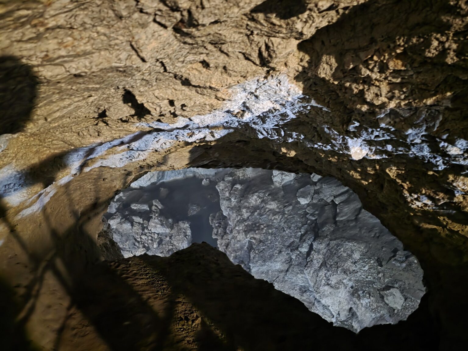 Entrance to dyavolskoto garlo cave with illuminated rock formations