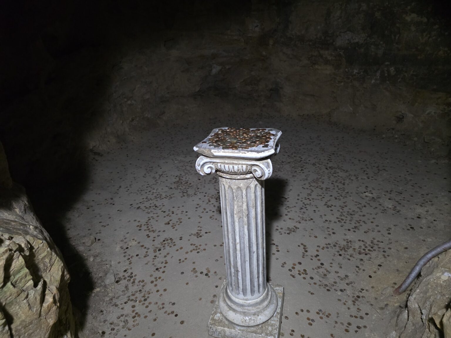 Decorative pillar with coins inside dyavolskoto garlo cave