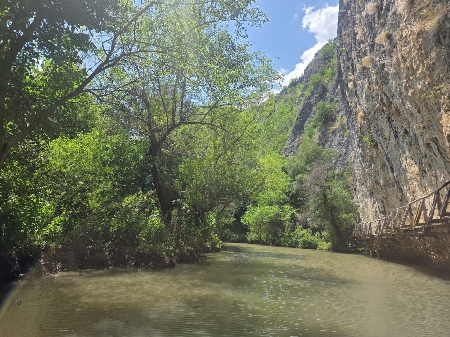 The rocks and a wooden footbridge over the Golden Panega